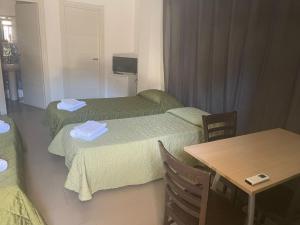 Krevet ili kreveti u jedinici u okviru objekta Hotel San Martino