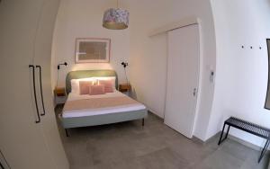 Postel nebo postele na pokoji v ubytování Lacass Apartment + 4 fotografie