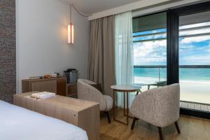 a hotel room with a view of the ocean at Oceania Saint Malo in Saint Malo