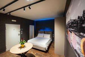 Postel nebo postele na pokoji v ubytování ArcoLoBello B&B ApartHotel