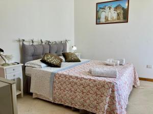 Postel nebo postele na pokoji v ubytování Le Dimore di Ike