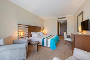 Postel nebo postele na pokoji v ubytování Green Max Hotel