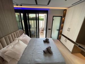 Voodi või voodid majutusasutuse Poseidon Beach Hotel toas
