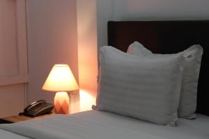 Postel nebo postele na pokoji v ubytování Hotel Belle Vie