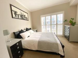 Кровать или кровати в номере Beach Stays Apartment
