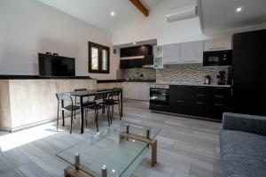 a kitchen with a table and chairs in a room at 20 metri dal mare in Imperia