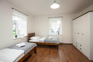Postel nebo postele na pokoji v ubytování Apartmány Vilka Orlík