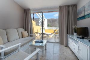 Гостиная зона в Apartamentos Punta Marina by LIVVO