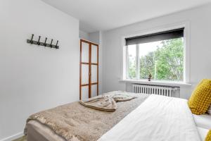 Postel nebo postele na pokoji v ubytování Flóki by Guesthouse Reykjavík