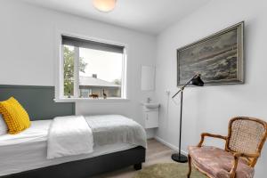 Postel nebo postele na pokoji v ubytování Flóki by Guesthouse Reykjavík