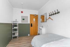 Postel nebo postele na pokoji v ubytování Flóki by Guesthouse Reykjavík