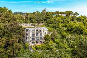 an aerial view of a mansion in the forest at Bay View Home, TerreMarine in La Spezia
