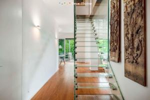 a glass staircase with glass railings in a house at Bay View Home, TerreMarine in La Spezia +28 photos