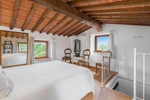 Postel nebo postele na pokoji v ubytování Vineyard’s Cottage With Pool, Ac, Wifi - Siena + 17 fotografií