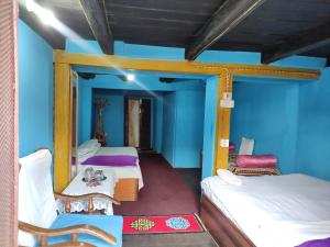 Postel nebo postele na pokoji v ubytování Kriti Home and Accomodation