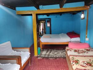Postel nebo postele na pokoji v ubytování Kriti Home and Accomodation