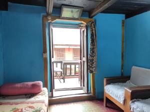 Postel nebo postele na pokoji v ubytování Kriti Home and Accomodation