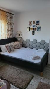 a large bed in a bedroom with a large mattress at Casa Remus in Sulina