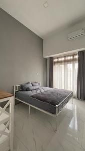 Postel nebo postele na pokoji v ubytování Sabbi's House