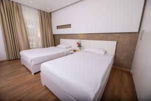 Postel nebo postele na pokoji v ubytování Prestige Resort