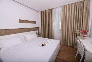 Postel nebo postele na pokoji v ubytování Prestige Resort