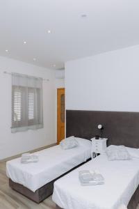 Letto o letti in una camera di Modianus Suite