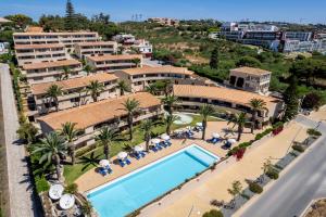 an aerial view of a resort with a swimming pool at Vila Palmeira Beach Resort in Lagos