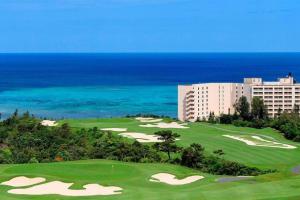 an aerial view of a golf course at the ocean at グランディオーソ沖縄プールヴィラ恩納6 in Onna