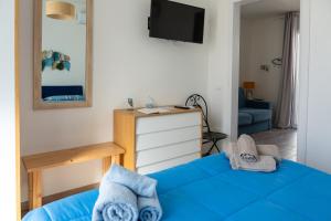 A bed or beds in a room at Seasons Home San Foca