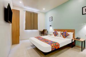 Ένα ή περισσότερα κρεβάτια σε δωμάτιο στο FabHotel Prime Ace II - Near Jupiter Hospital