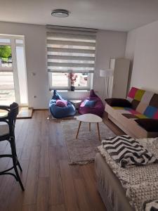 a living room with a couch and a table at Ina in Kupres