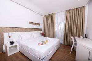 Postel nebo postele na pokoji v ubytování Prestige Resort