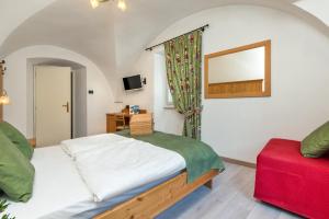 Posteľ alebo postele v izbe v ubytovaní Albergo Alla Costa
