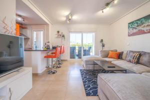 a living room with a couch and a kitchen at Modern 3 bedroom Town House MA14LT in Torre-Pacheco