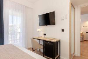 TV a/nebo společenská místnost v ubytování Hotel Rovira