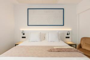 Postel nebo postele na pokoji v ubytování Hotel Rovira