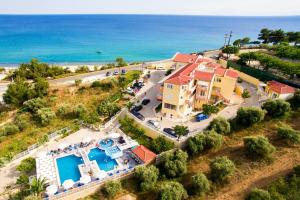 an aerial view of a house and the ocean at Hotel Diamond in Limenaria