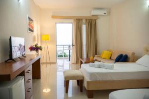 TV a/nebo společenská místnost v ubytování Hotel Blue Days