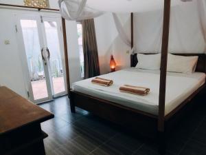 Postel nebo postele na pokoji v ubytování Balengku Homestay