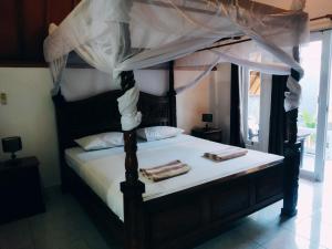 Postel nebo postele na pokoji v ubytování Balengku Homestay