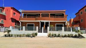 a house with a balcony in front of it at Avalon Villa in Santa Maria
