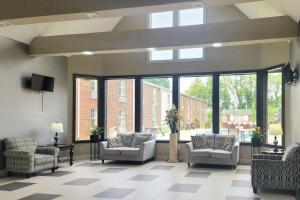a large waiting room with chairs and windows at Quality Inn Dublin I-81 in Dublin