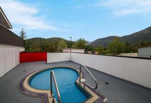 a swimming pool on the roof of a house at SureStay Hotel by Best Western Rossland Red Mountain in Rossland