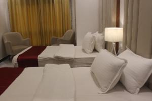 Postel nebo postele na pokoji v ubytování Hotel Belle Vie