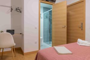 Postel nebo postele na pokoji v ubytování CINCO VILLAS
