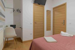 Postel nebo postele na pokoji v ubytování CINCO VILLAS