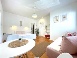 a living room with a couch and a table at MAKEDONKA Apartments in Ohrid