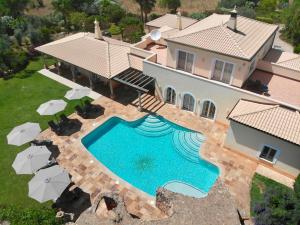 an aerial view of a house with a swimming pool at Vila Relaxmountain B&B in São Bartolomeu de Messines