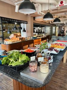 a buffet line with many different types of food at Hotel Giò; BW Signature Collection in Solna