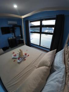 Postel nebo postele na pokoji v ubytování La Salangane Beach Hotel - Downtown